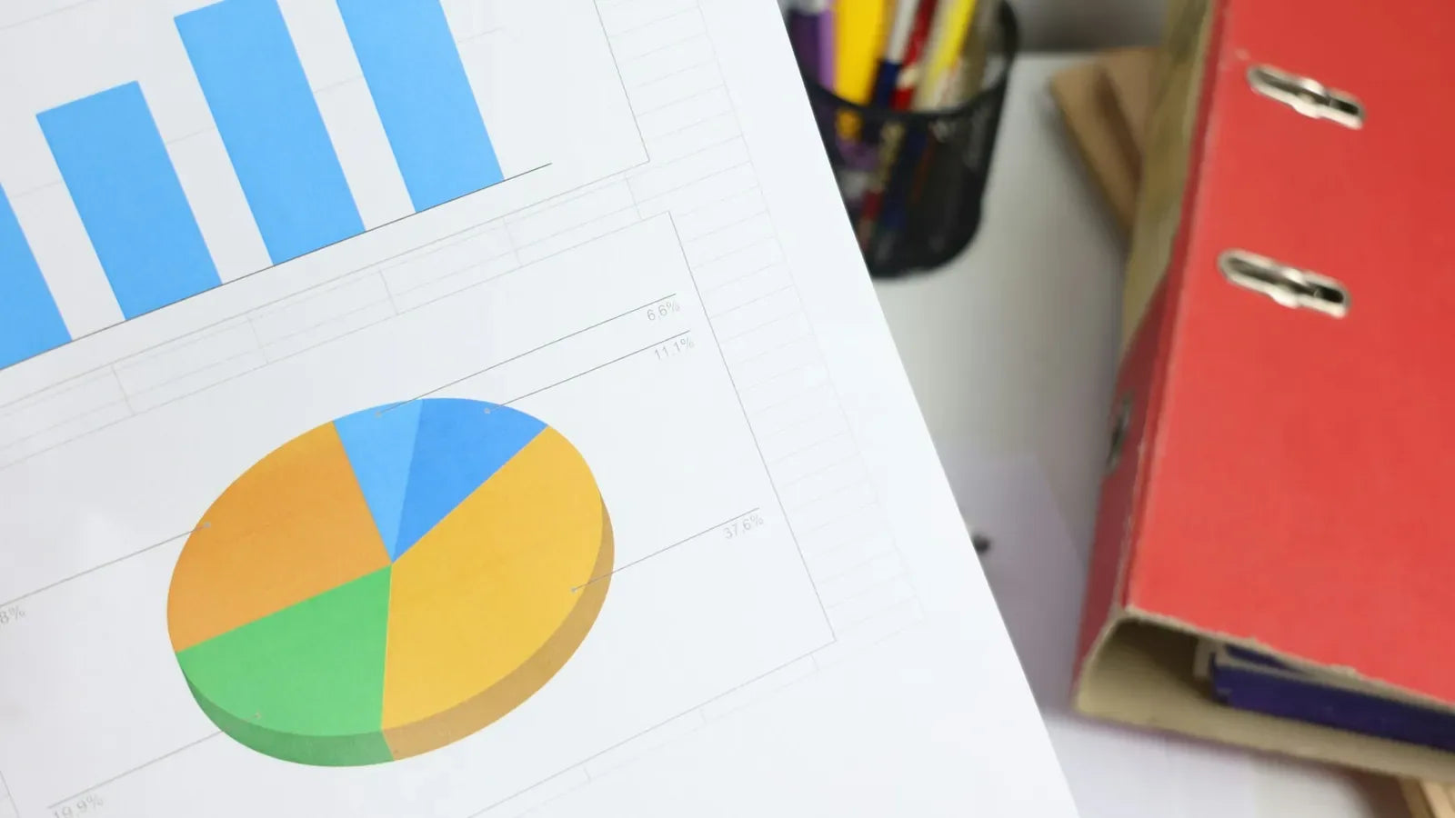 Bar and pie charts on a document.
