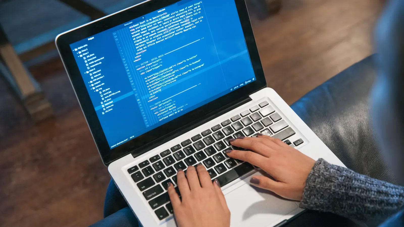 Hands Typing Code On Laptop.