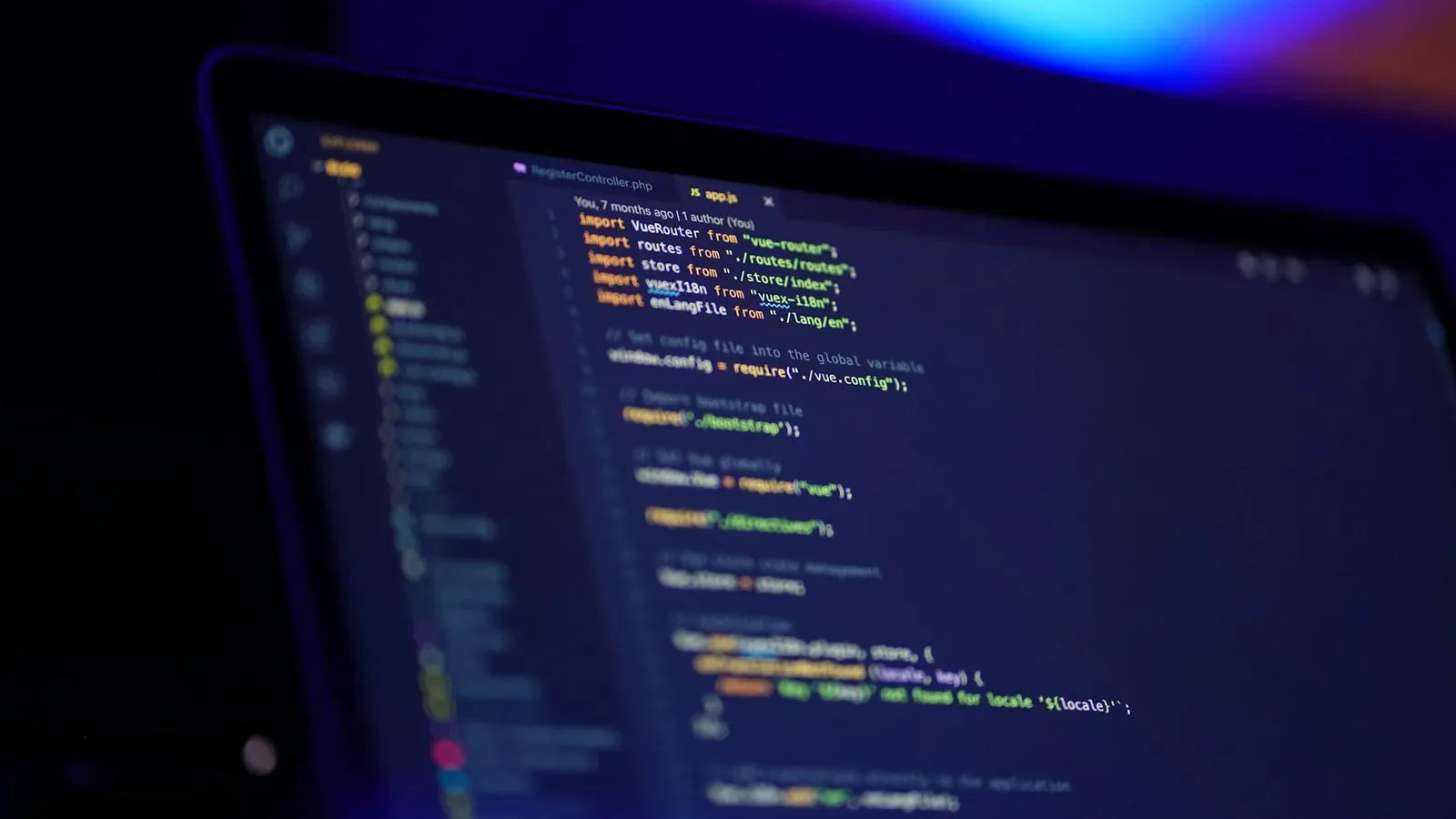 Laptop screen displaying colorful code.